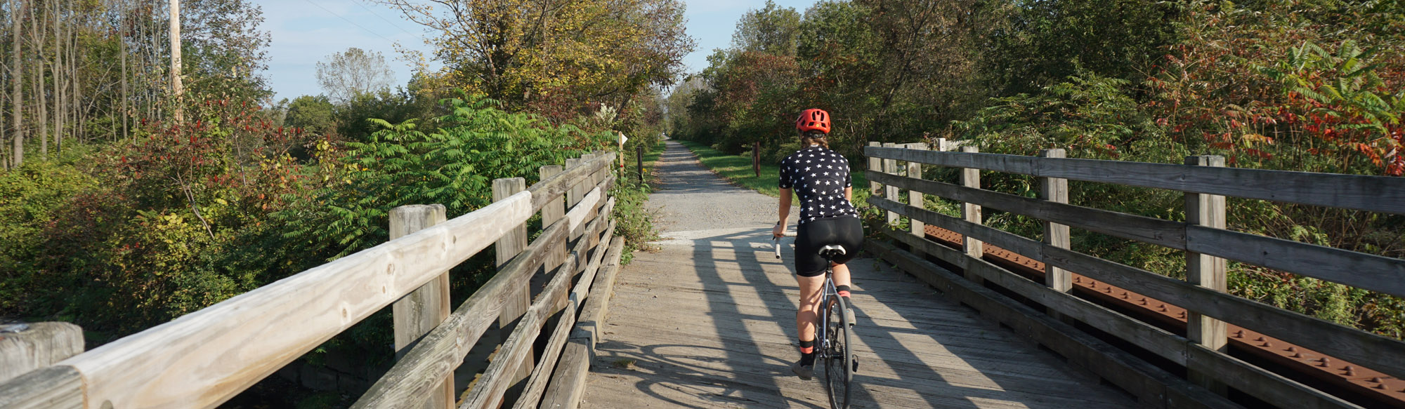 rider enjoying bridge crossing on Erie Canalway Trail