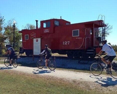 red caboose with self-guided bike tour riders