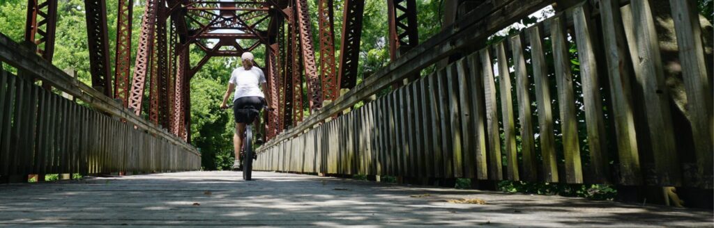 riding over a bridge on the Katy trail